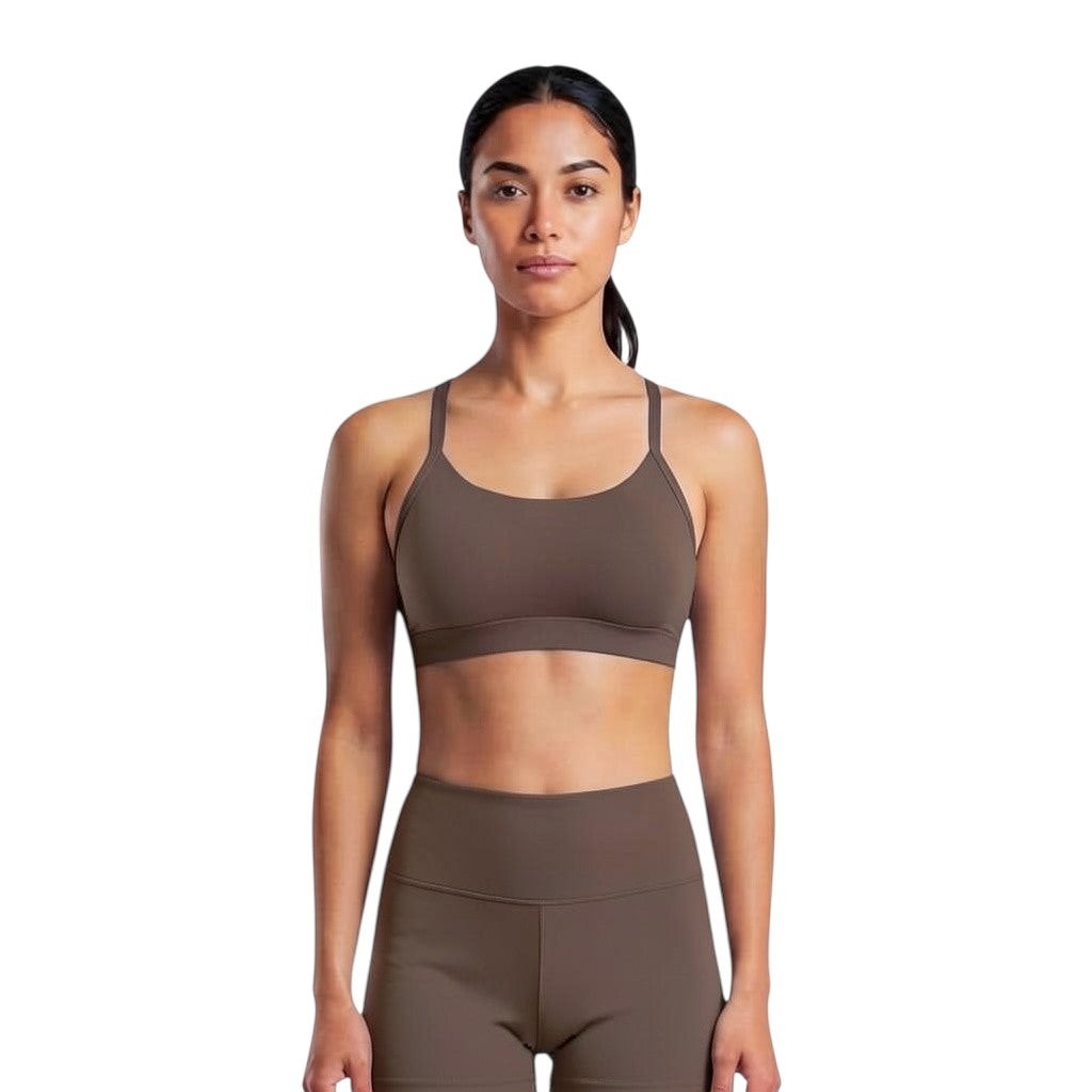 Model wearing a brown VARO On Repeat Bra in soft ShapeFlow knit fabric with a comfortable, low-impact design.