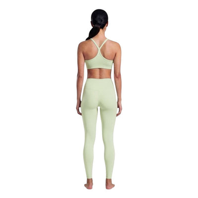 VARO On Repeat Bra in light green recycled nylon with a racerback design, worn by a model from the back view.